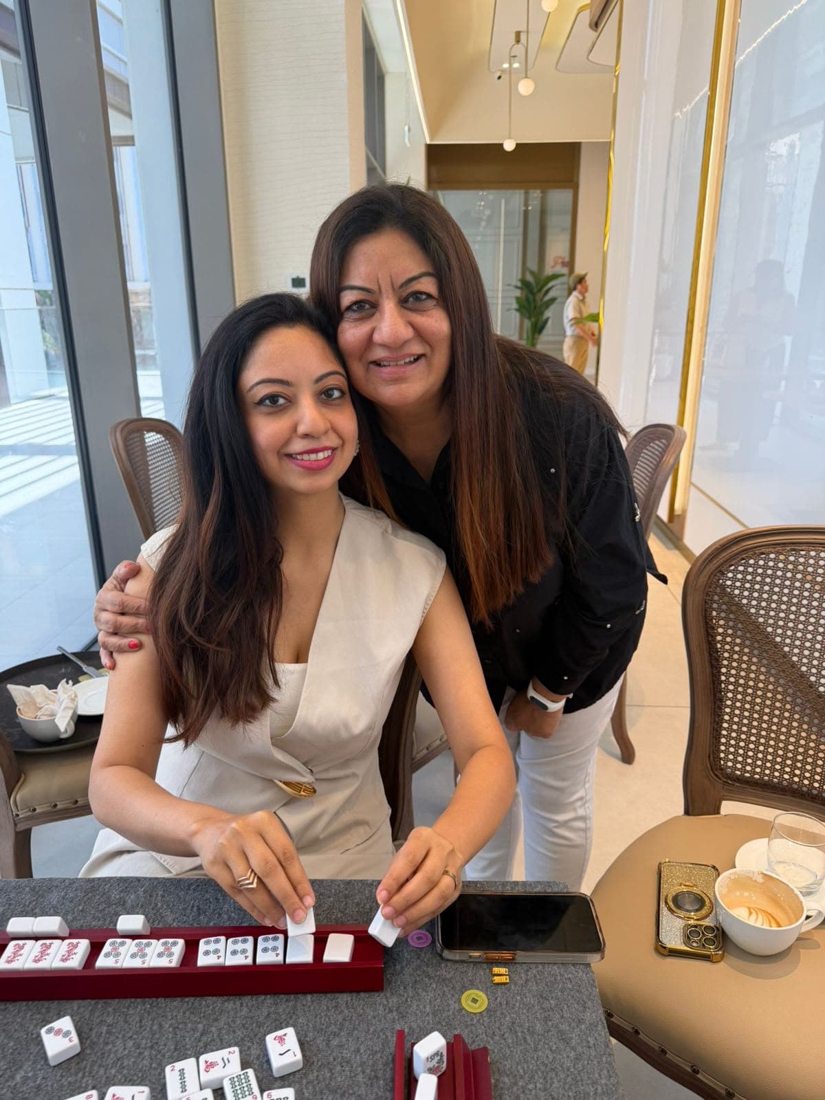 Vansa and Neha Bali at a Mahjong table in Dubai