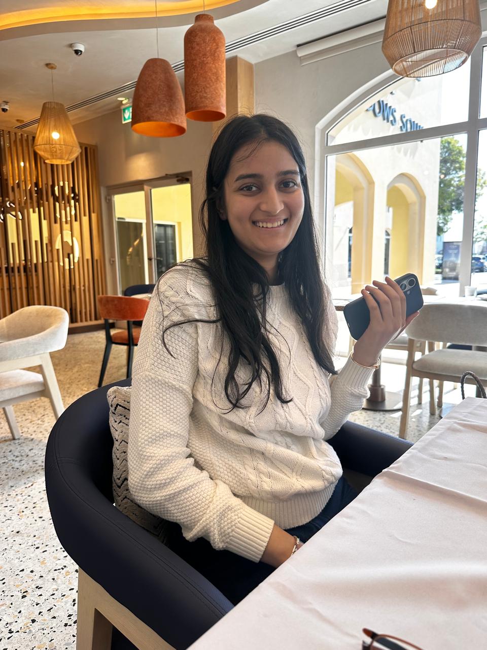 Beginner Mahjong player seated at a Dubai table