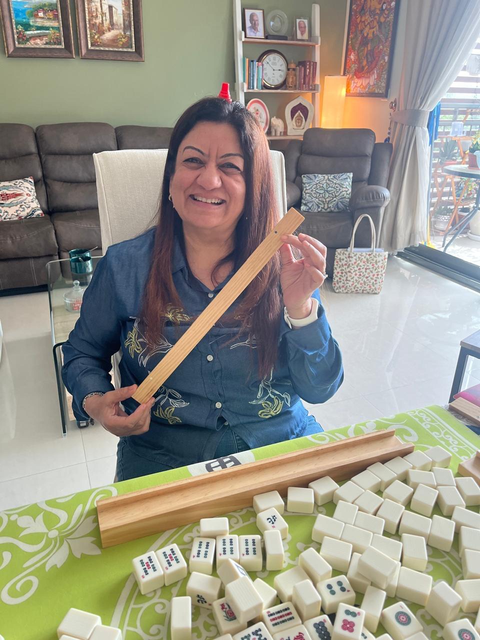 Mahjong rack and tiles arranged for a style lesson